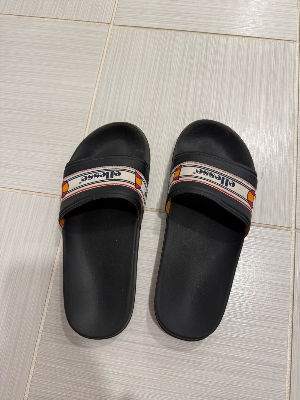ellesse Black Slide Sandals with White Logo Strap and Orange Accents